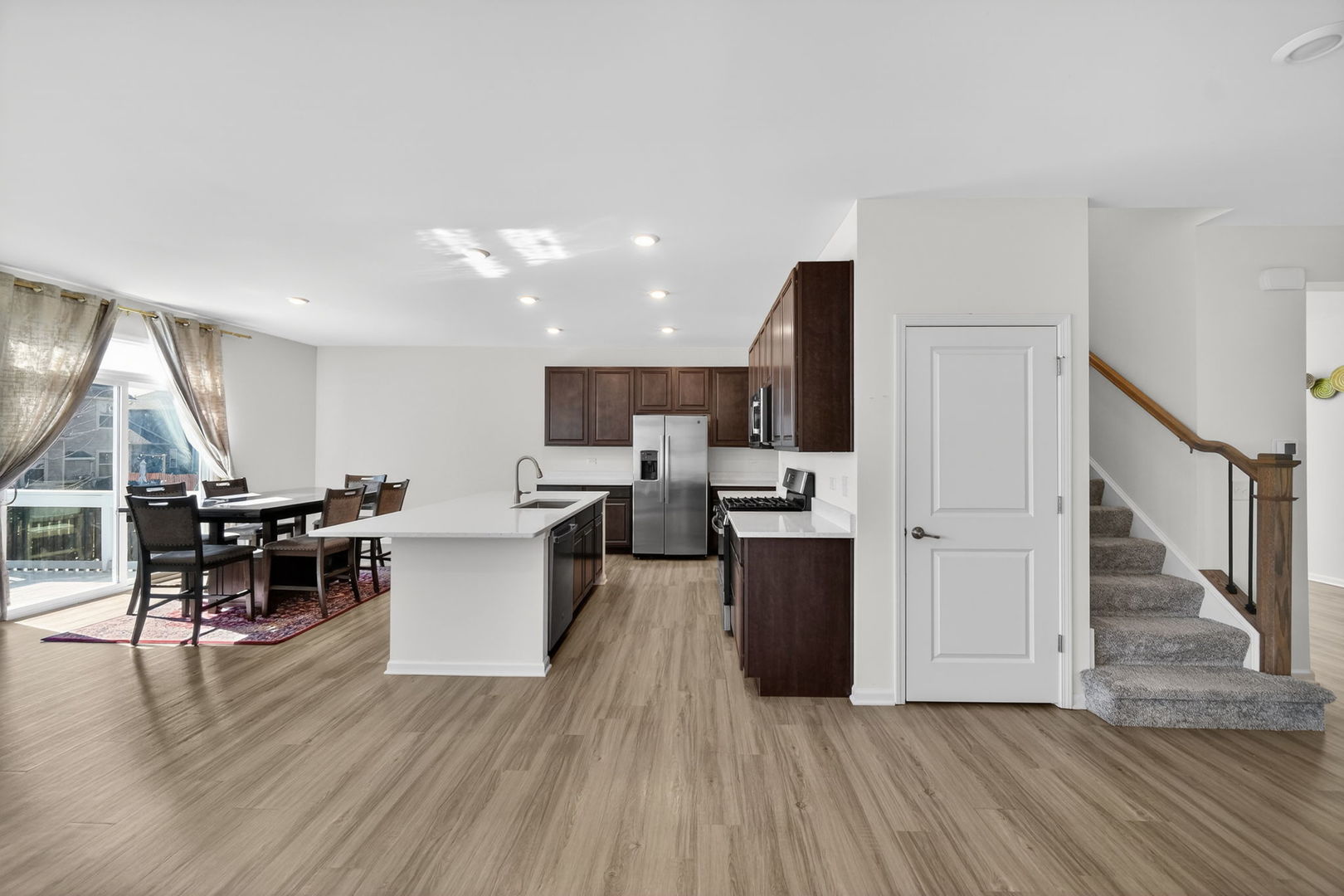 3803 Ivy Lane Elgin, IL 60124 - Photo 11 of 43 a view of a kitchen with cabinets and wooden floor