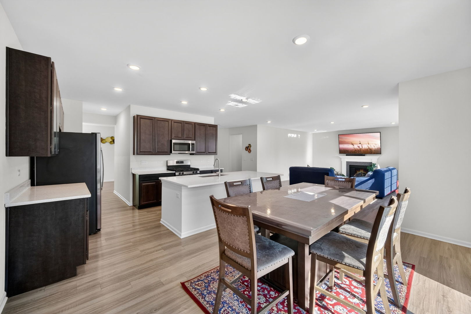 3803 Ivy Lane Elgin, IL 60124 - Photo 16 of 43 a view of a dining room with furniture and wooden floor