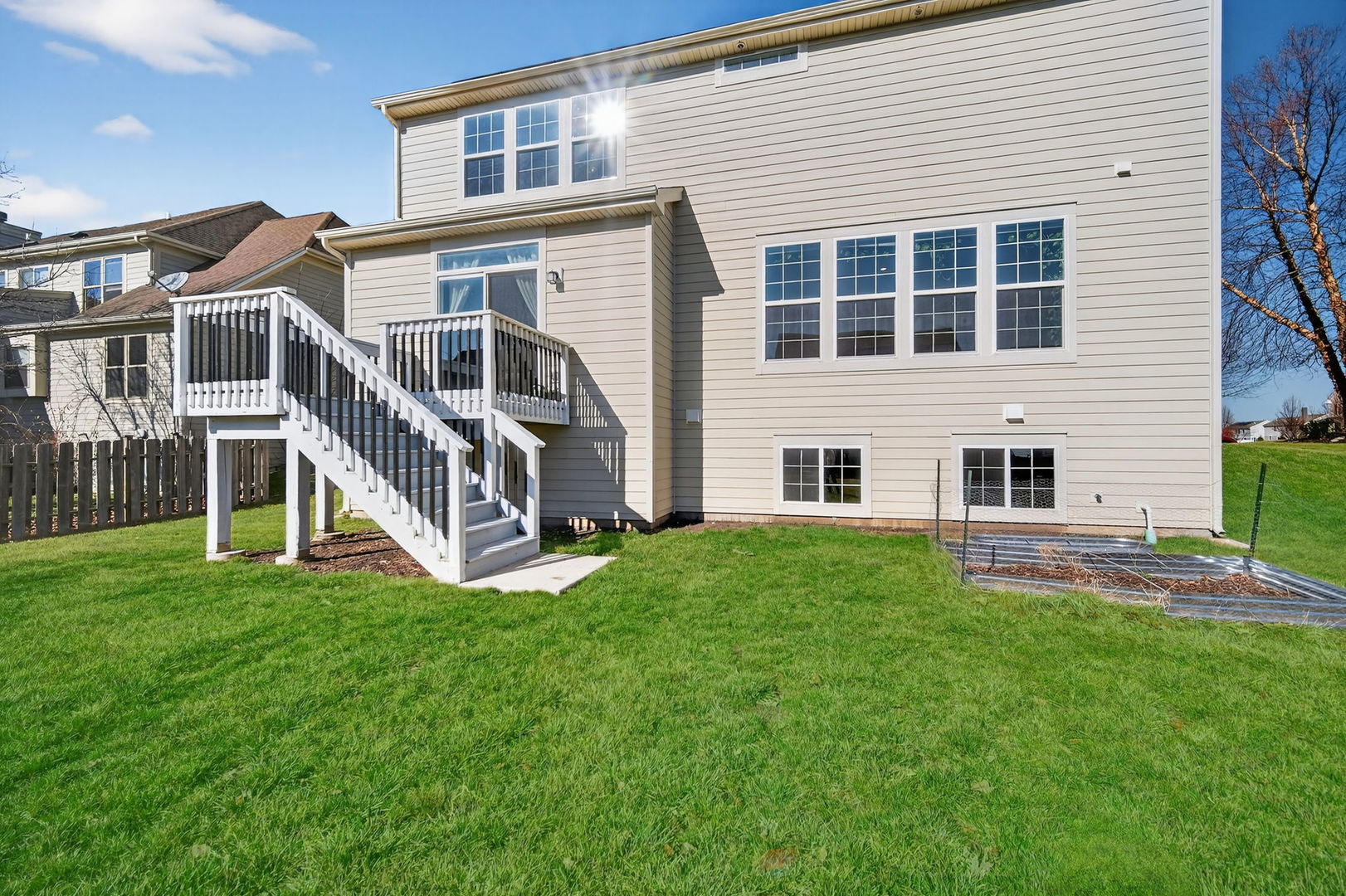 3803 Ivy Lane Elgin, IL 60124 - Photo 39 of 43 a view of a house with a yard and a large window