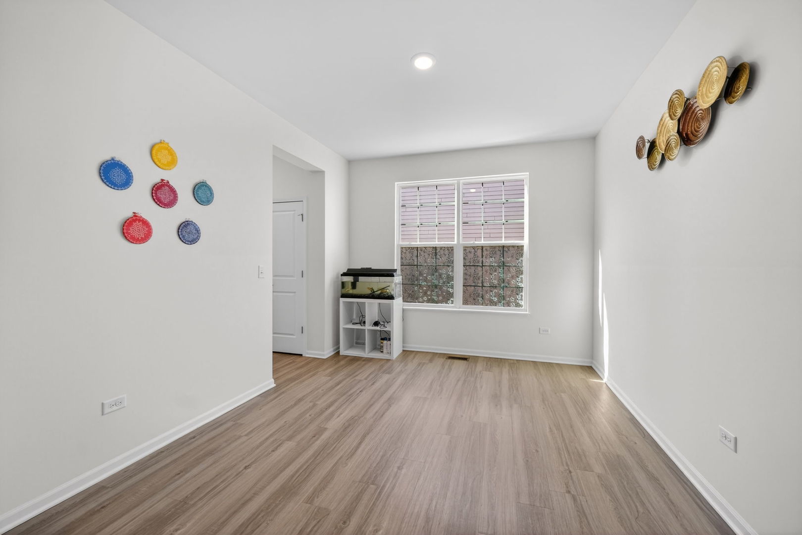 3803 Ivy Lane Elgin, IL 60124 - Photo 6 of 43 wooden floor in an empty room with a window
