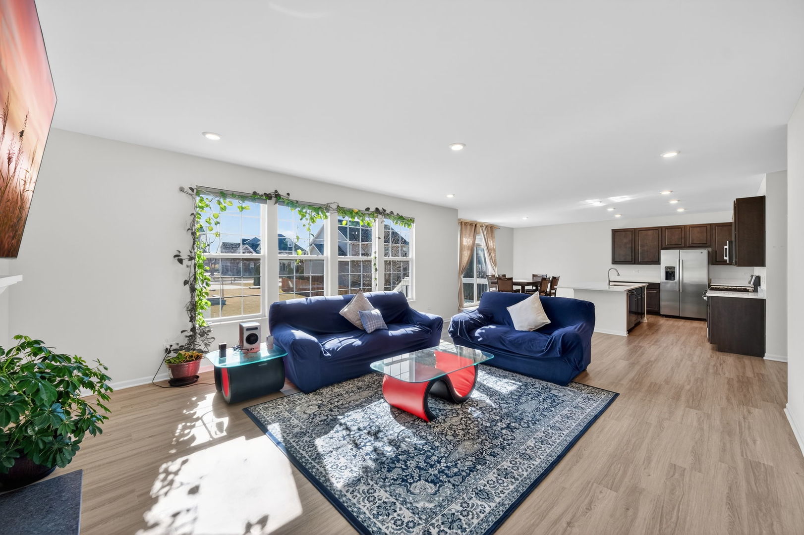 3803 Ivy Lane Elgin, IL 60124 - Photo 9 of 43 a living room with furniture kitchen view and a large window