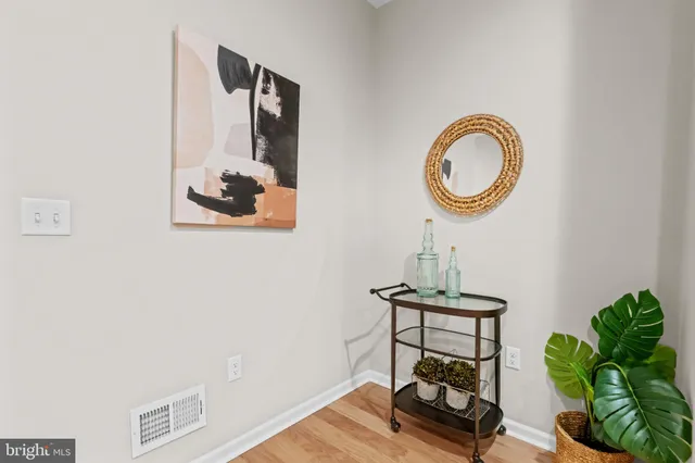 a view of a room with a table and chairs