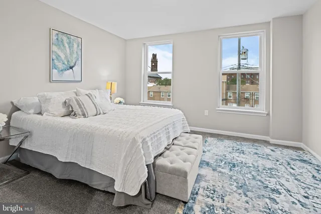 a bedroom with bed and a window