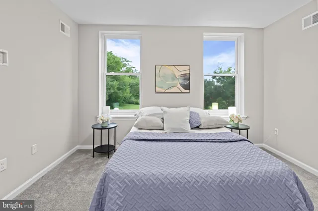 a bed room with a bed and a window