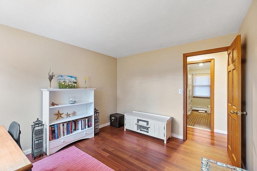 376 Littleton Road Chelmsford, MA 01824 - Photo 23 of 35 a living room with furniture and a wooden floor