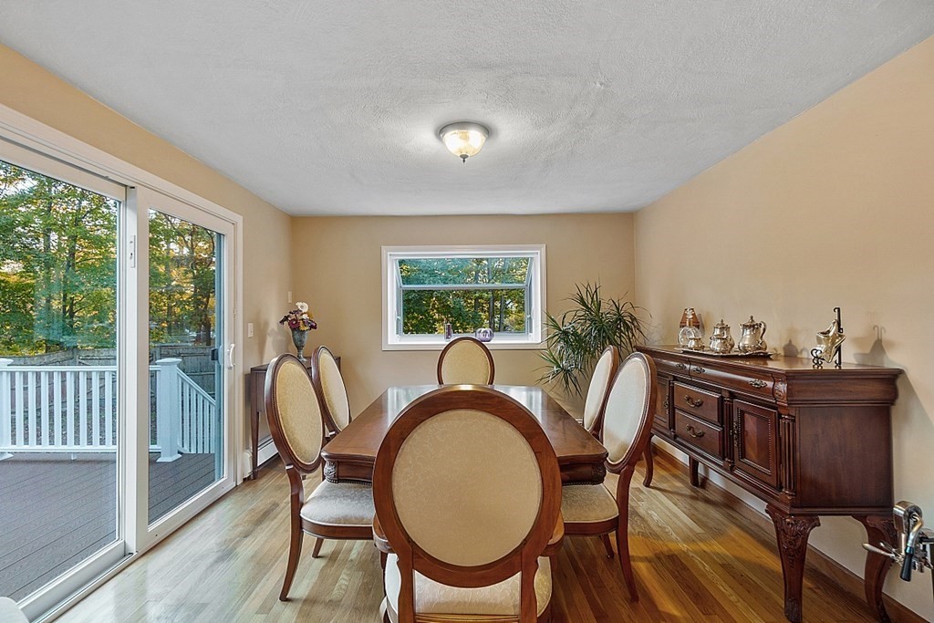 376 Littleton Road Chelmsford, MA 01824 - Photo 8 of 35 a dining room with furniture window and wooden floor