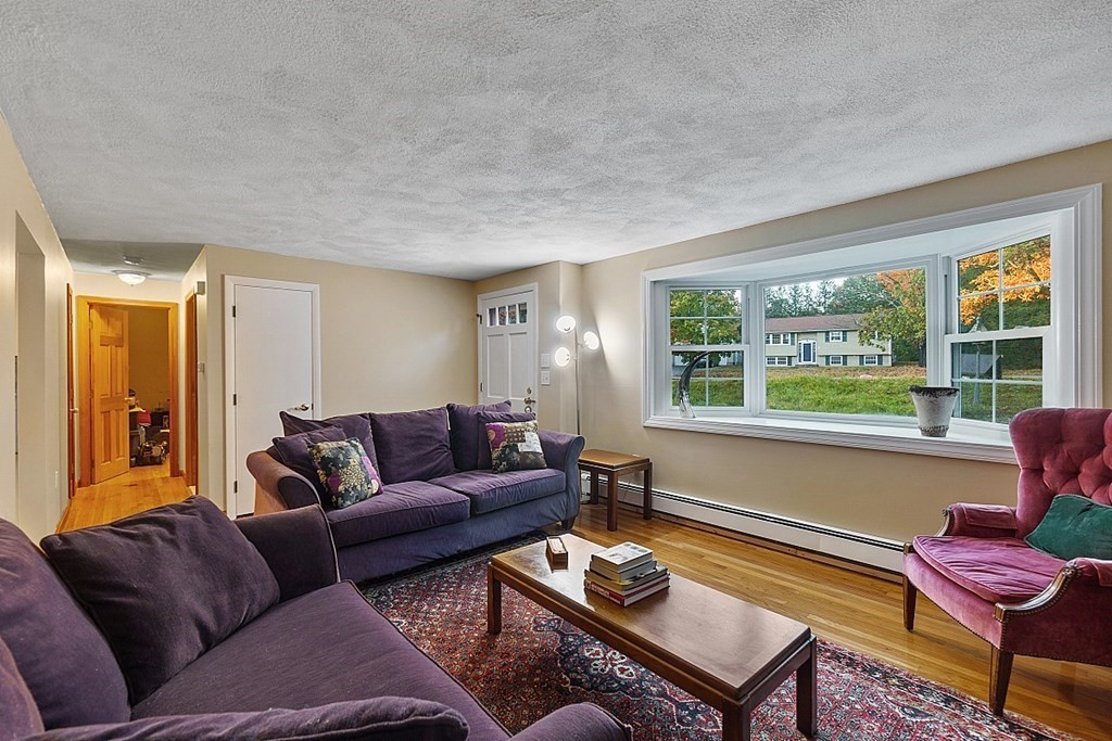 376 Littleton Road Chelmsford, MA 01824 - Photo 9 of 35 a living room with furniture and a window
