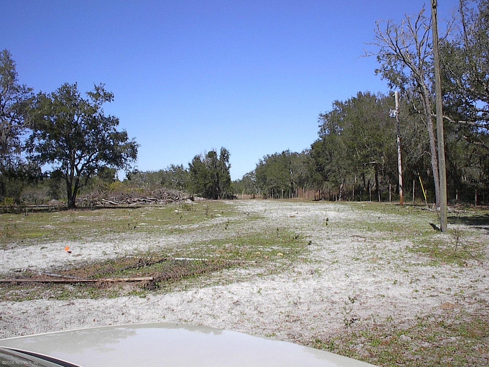 2450 Cade Fernery Road Seville, FL 32190 - Photo 4 of 4 a view of dirt field with trees