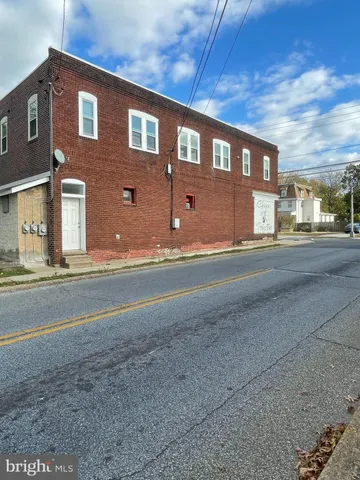 a front view of a building with a street