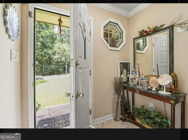a very nice looking room with a large window table and chairs