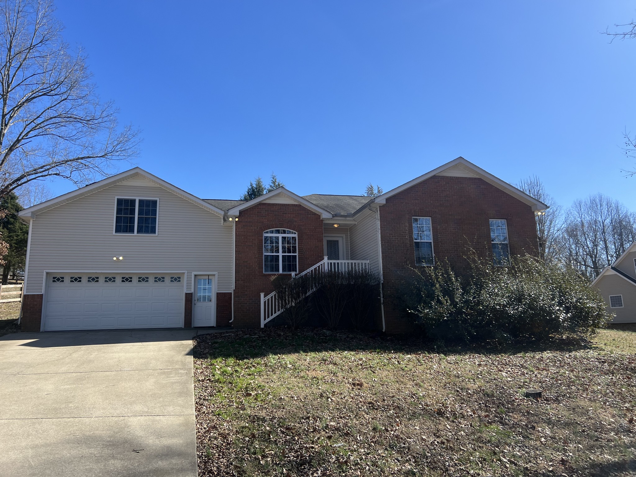 192 Wilkinson Road Cottontown, TN 37048 - Photo 1 of 20 a front view of a house with a yard