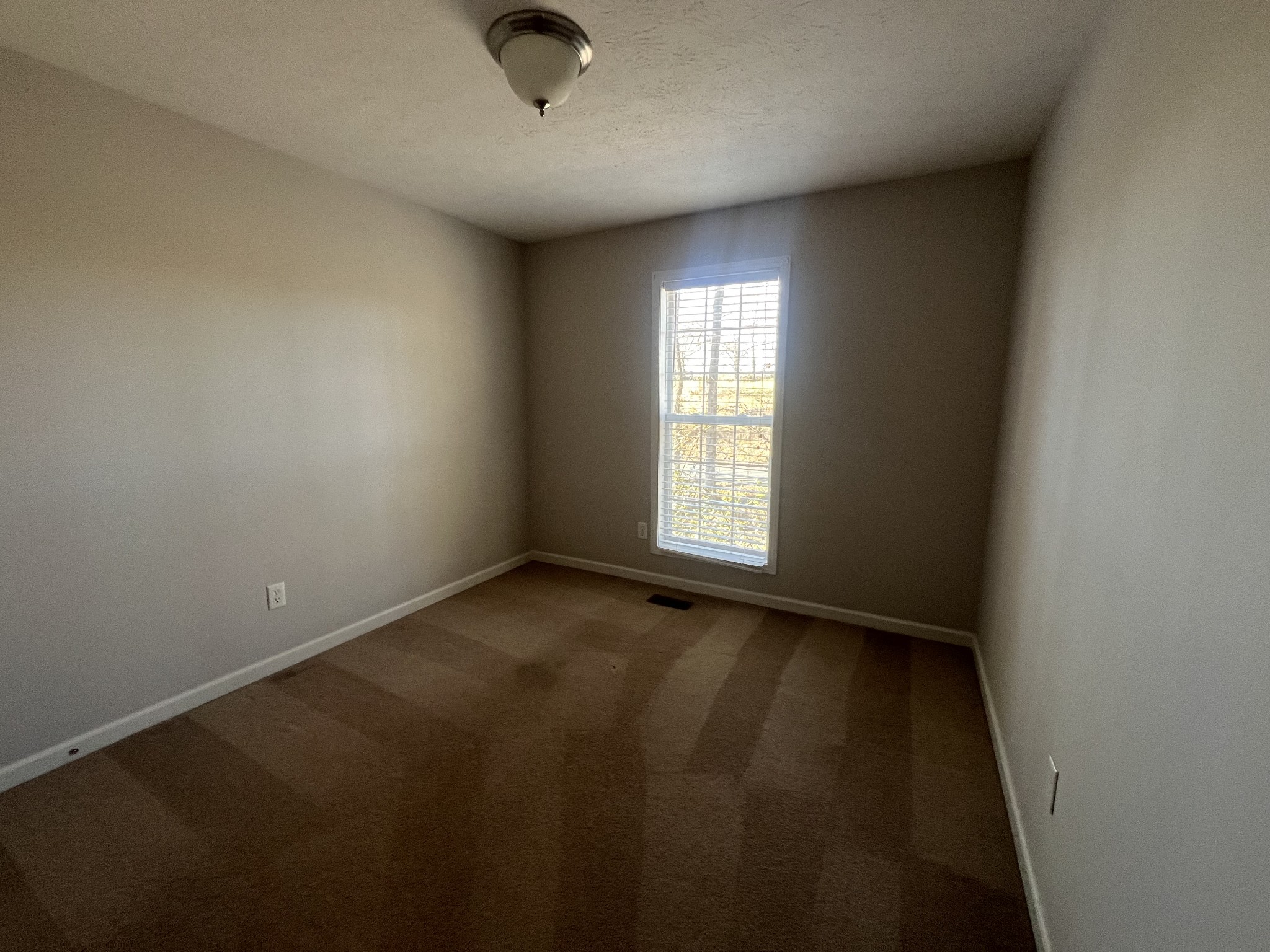 192 Wilkinson Road Cottontown, TN 37048 - Photo 13 of 20 an empty room with a empty space and a window