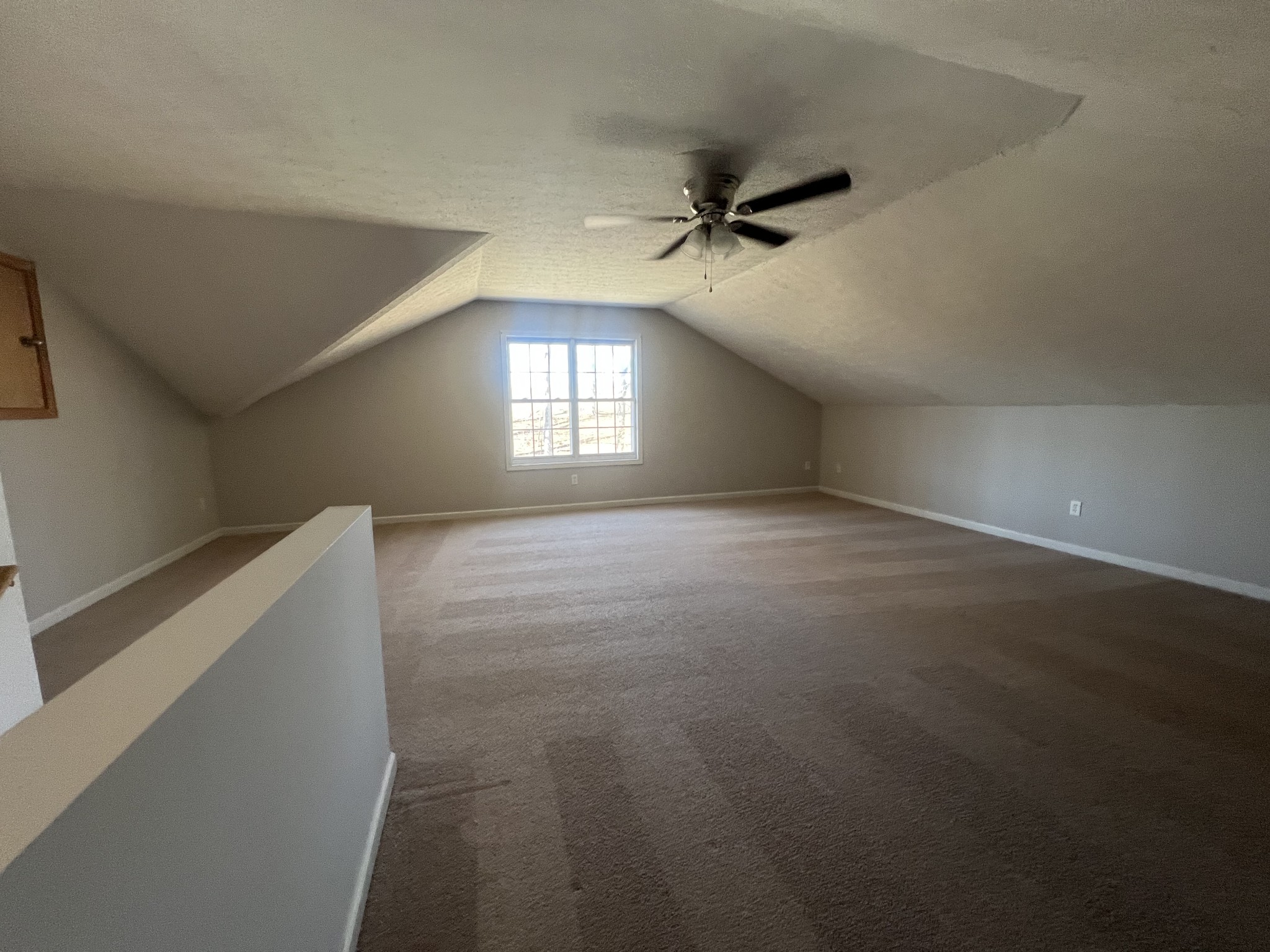 192 Wilkinson Road Cottontown, TN 37048 - Photo 20 of 20 a view of empty room with window and stairs
