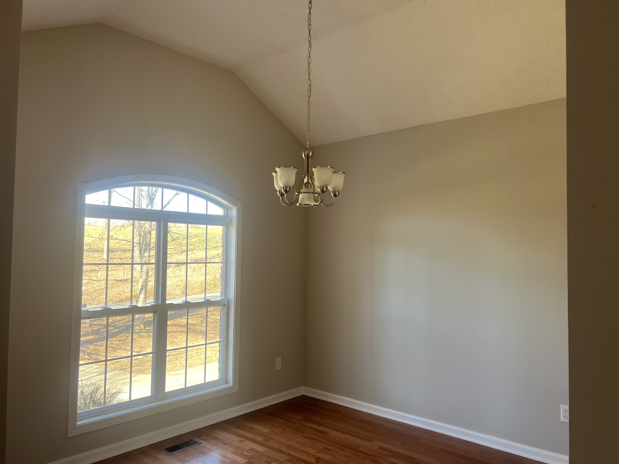 192 Wilkinson Road Cottontown, TN 37048 - Photo 2 of 20 an empty room with wooden floor and windows