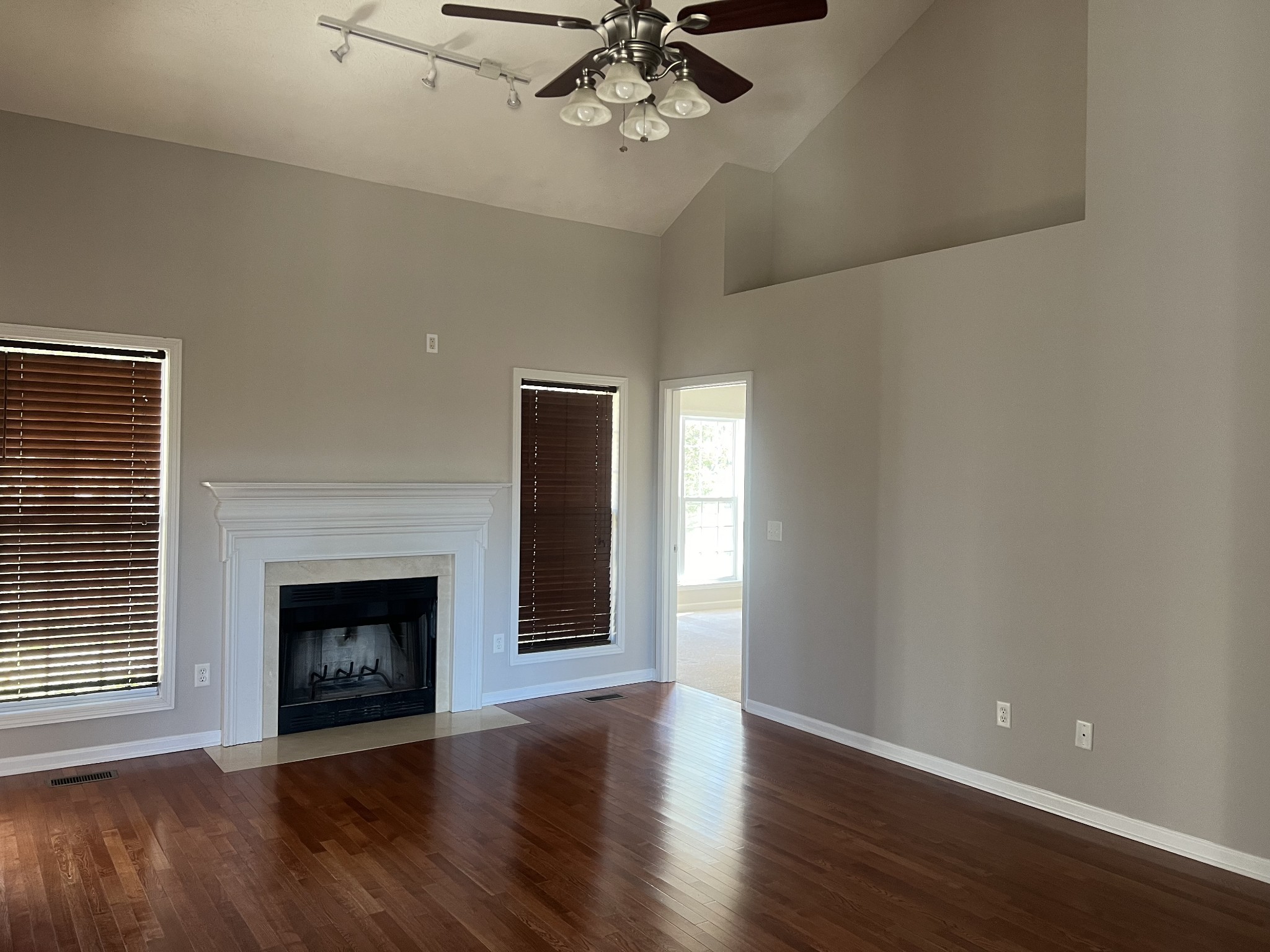 192 Wilkinson Road Cottontown, TN 37048 - Photo 3 of 20 a view of an empty room with a fireplace and a window