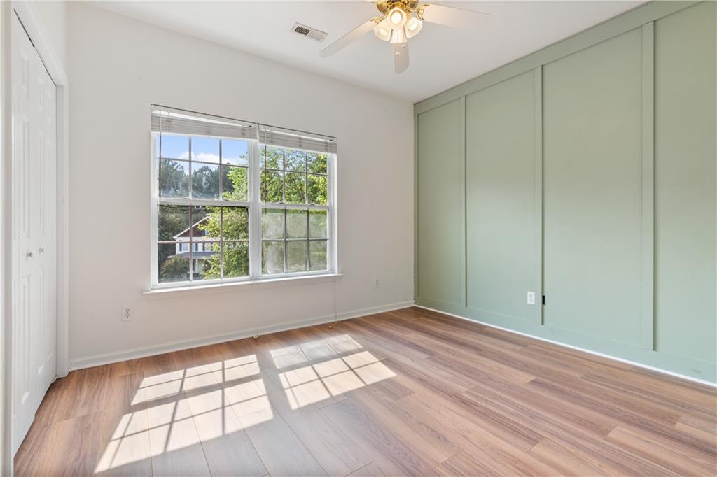 14 Bryan Springs Road Southwest Rome, GA 30165 - Photo 15 of 40 wooden floor in an empty room with a window