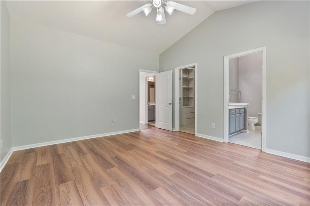 14 Bryan Springs Road Southwest Rome, GA 30165 - Photo 19 of 40 wooden floor in an empty room with a window