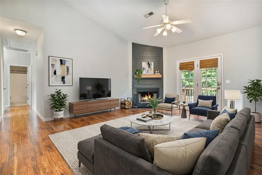 14 Bryan Springs Road Southwest Rome, GA 30165 - Photo 2 of 40 a living room with furniture fireplace and a flat screen tv