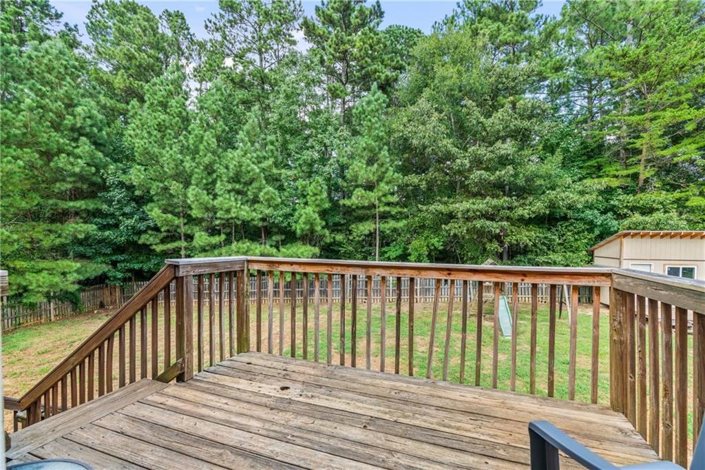 14 Bryan Springs Road Southwest Rome, GA 30165 - Photo 27 of 40 a balcony with trees in front of it