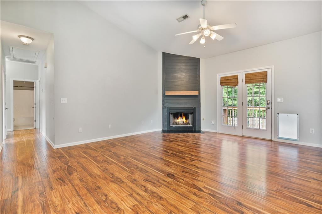 14 Bryan Springs Road Southwest Rome, GA 30165 - Photo 3 of 40 a view of empty room with wooden floor and fan