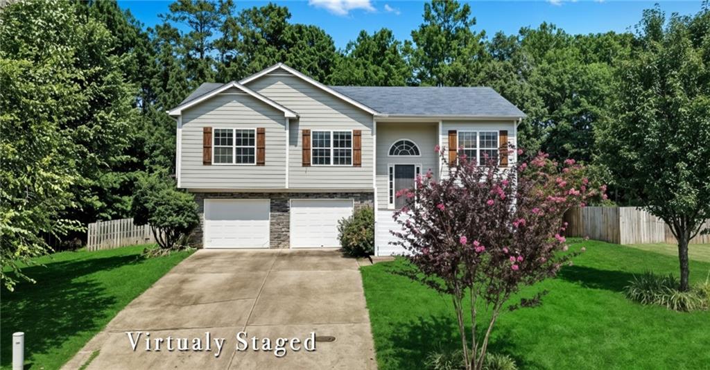 14 Bryan Springs Road Southwest Rome, GA 30165 - Photo 40 of 40 a front view of a house with a yard and garage