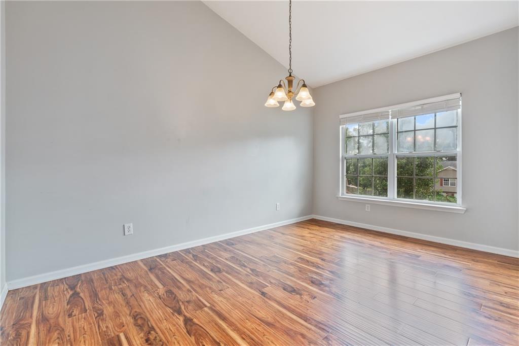 14 Bryan Springs Road Southwest Rome, GA 30165 - Photo 6 of 40 wooden floor in an empty room with a window