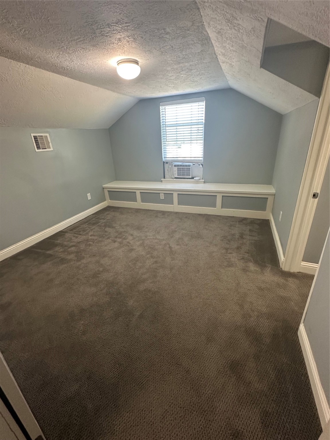 4924 Polk Street Houston, TX 77023 - Photo 10 of 15 an empty room with a window