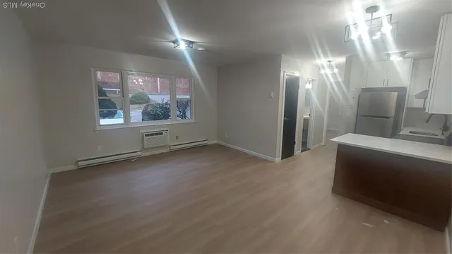 a kitchen that has a sink and a refrigerator
