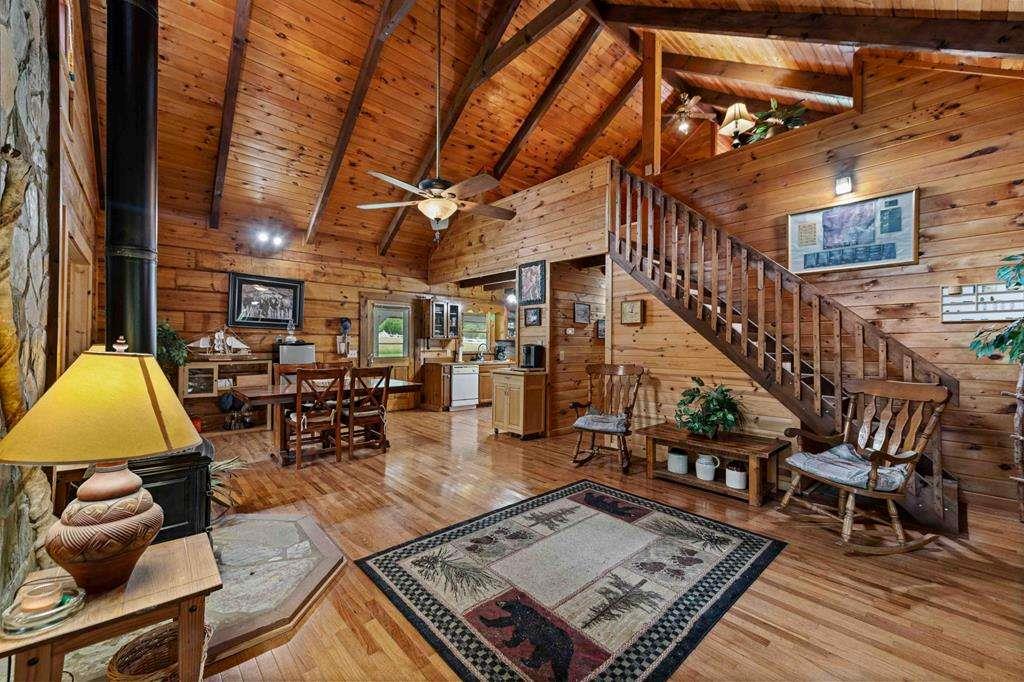 332 Night Lane Epworth, GA 30541 - Photo 22 of 84 a living room with lots of furniture and a rug