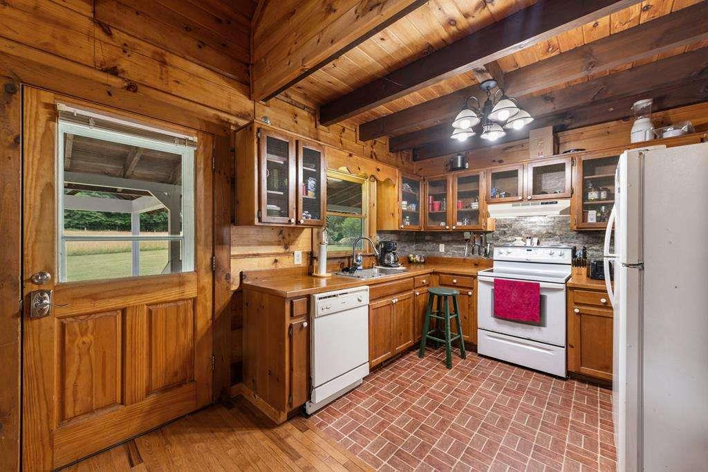 332 Night Lane Epworth, GA 30541 - Photo 25 of 84 a kitchen with stainless steel appliances granite countertop a refrigerator and a stove top oven
