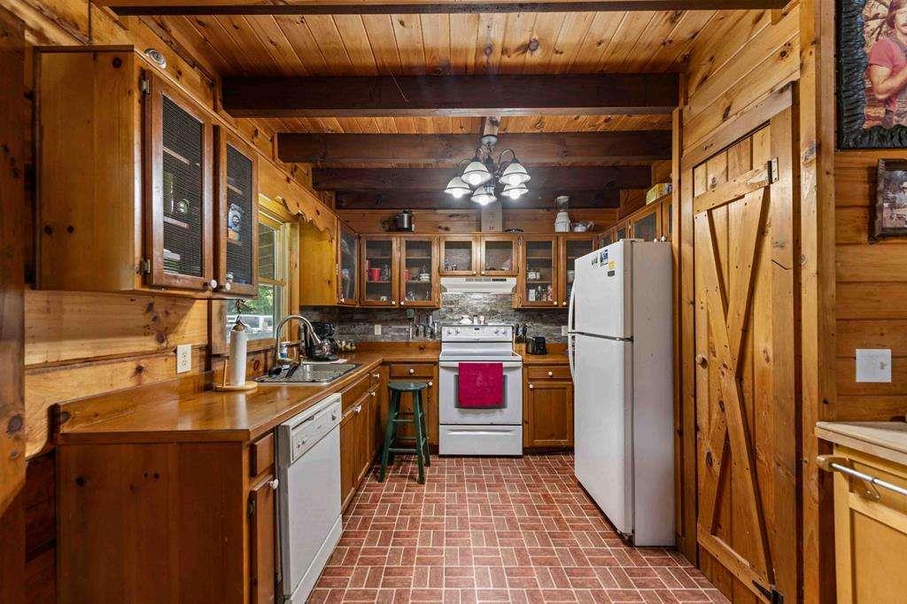 332 Night Lane Epworth, GA 30541 - Photo 26 of 84 a kitchen with a refrigerator and a stove