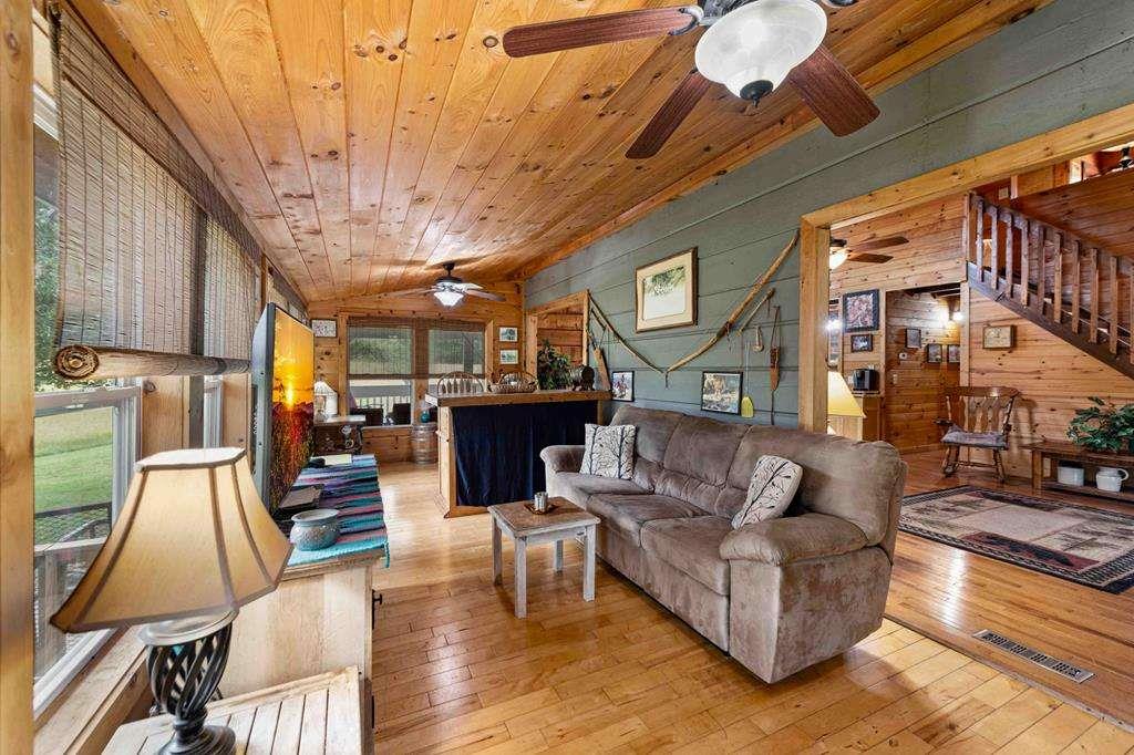 332 Night Lane Epworth, GA 30541 - Photo 27 of 84 a living room with furniture and wooden floor