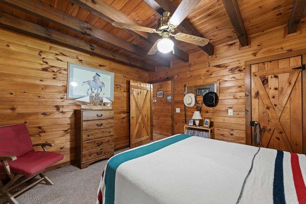 332 Night Lane Epworth, GA 30541 - Photo 33 of 84 a bed room with a bed and a chair