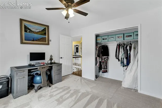 a view of a workspace with furniture and workspace