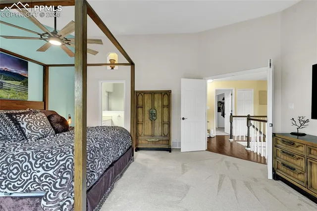 a bedroom with double bed and a window