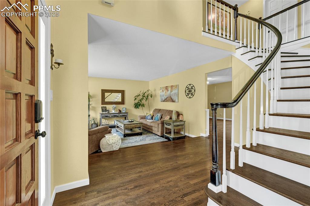 35 Lowick Drive Colorado Springs, CO 80906 - Photo 3 of 32 a view of a livingroom with wooden floor and stairs