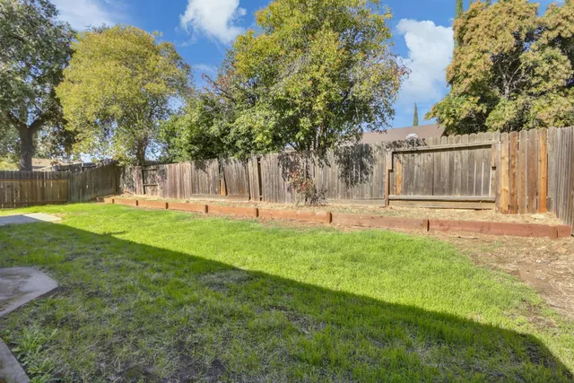 a view of a yard in front of house