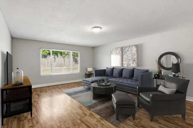 a living room with furniture and a window