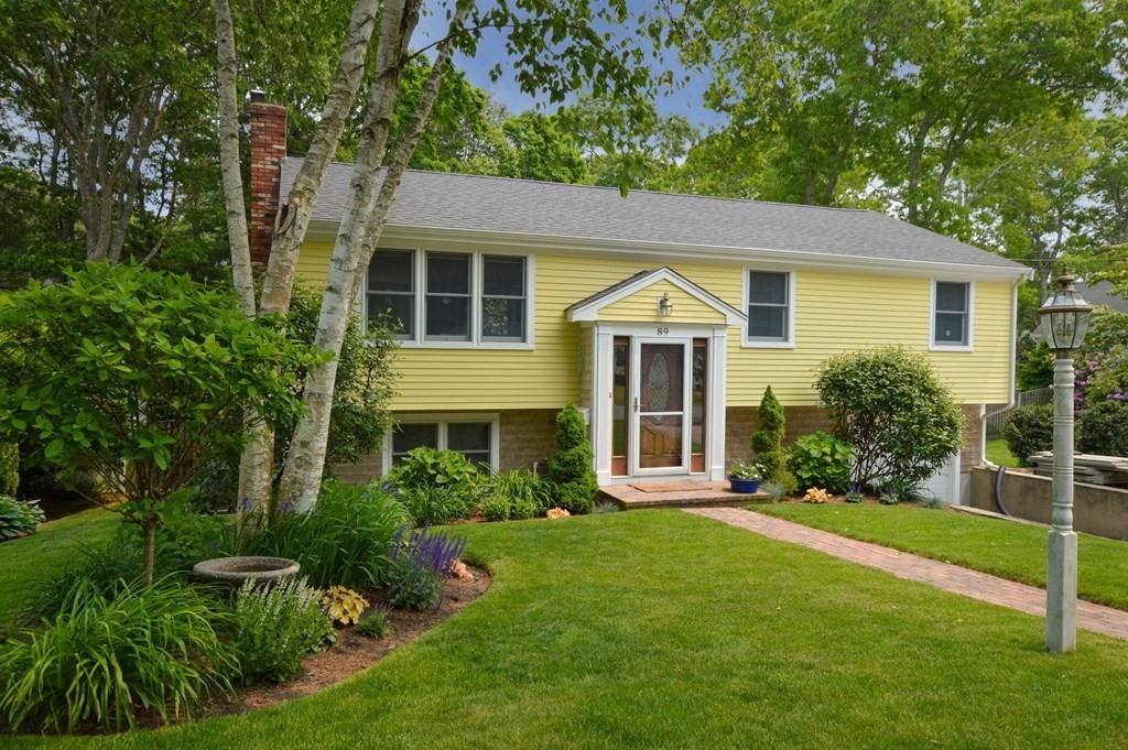 front view of a house with a yard