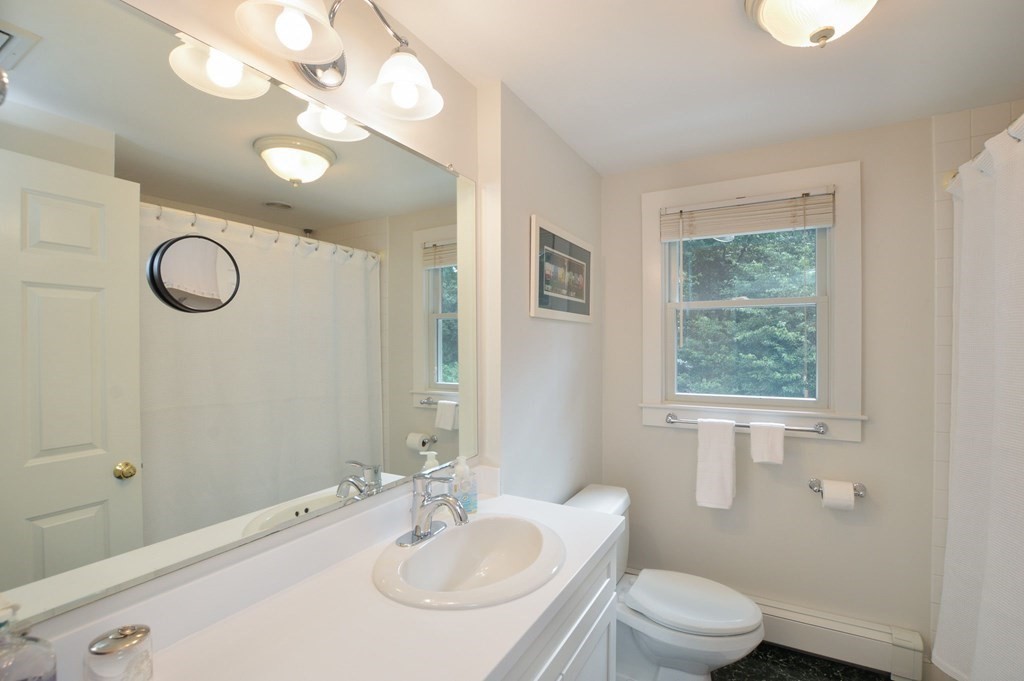 89 Emerson Way Barnstable, MA 02632 - Photo 17 of 26 a bathroom with a sink a toilet and a mirror