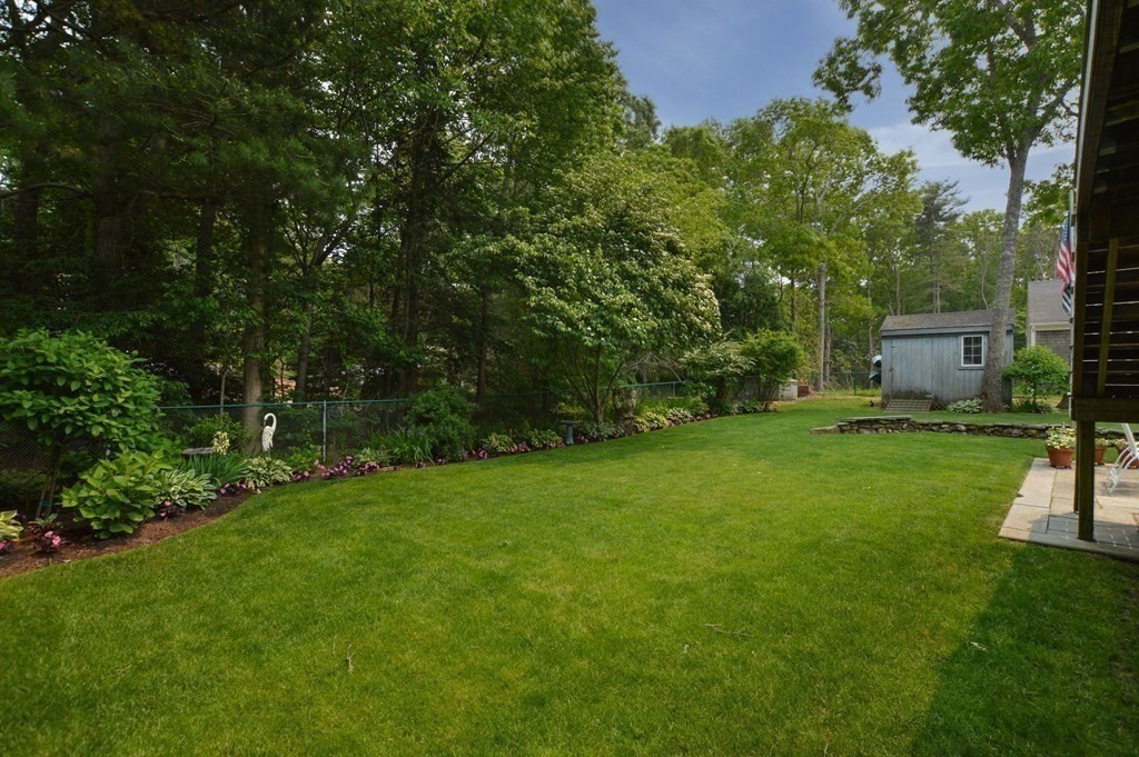 89 Emerson Way Barnstable, MA 02632 - Photo 25 of 26 a view of a backyard with a garden