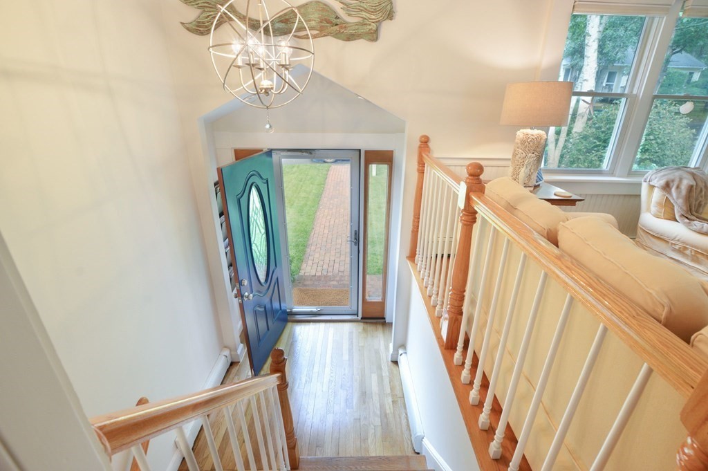 89 Emerson Way Barnstable, MA 02632 - Photo 3 of 26 a view of a livingroom with wooden floor and stairs