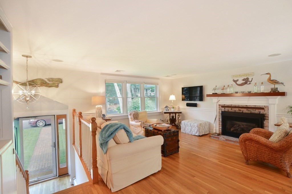 89 Emerson Way Barnstable, MA 02632 - Photo 4 of 26 a living room with furniture and a fireplace