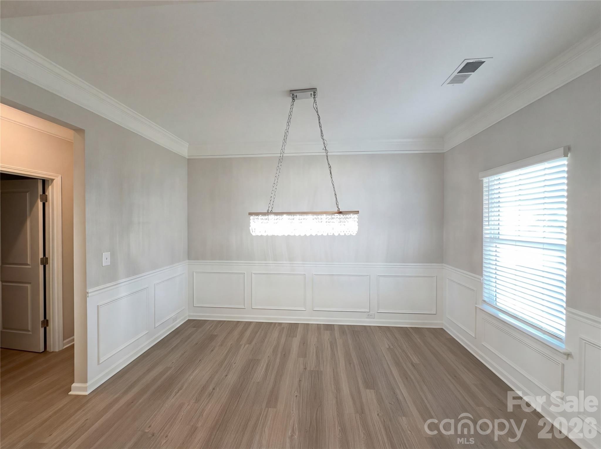 617 Ardsley Drive Locust, NC 28097 - Photo 17 of 23 wooden floor in an empty room with a window