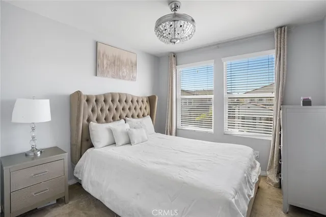 a bedroom with a large bed and a table