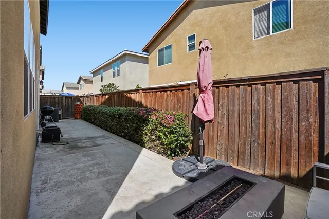 a view of a house with wooden fence
