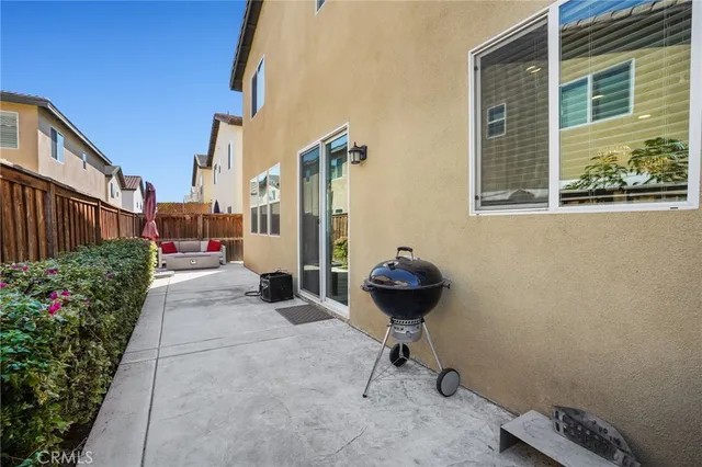a view of a backyard with sitting area and garden