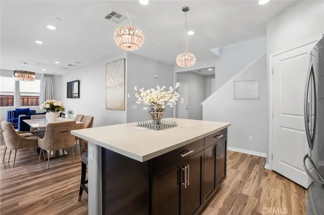 a kitchen with a table and chairs
