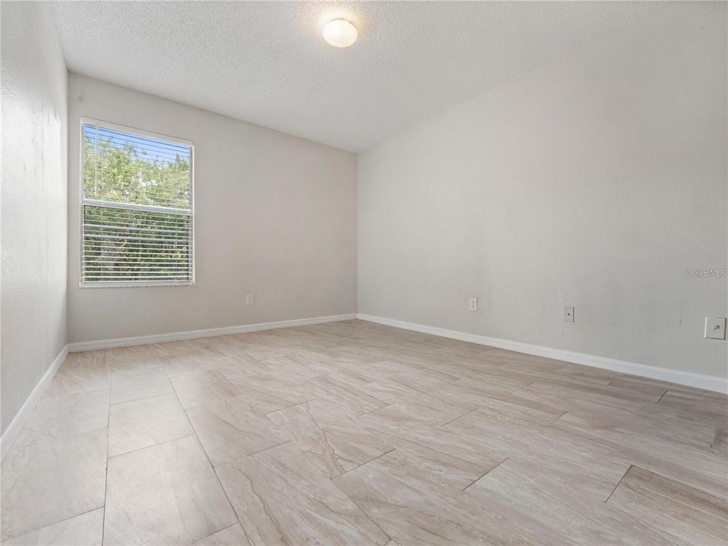 5144 Conroy Road, Unit 27 Orlando, FL 32811 - Photo 12 of 20 an empty room with a window