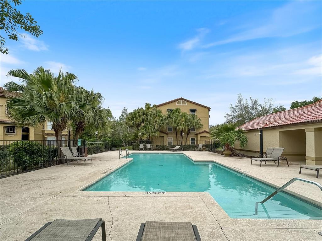 5144 Conroy Road, Unit 27 Orlando, FL 32811 - Photo 17 of 20 a view of a swimming pool with a patio